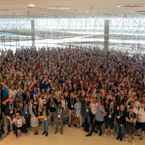 Large group of people at DrupalCon Barcelona 2024 posting for a group photo.